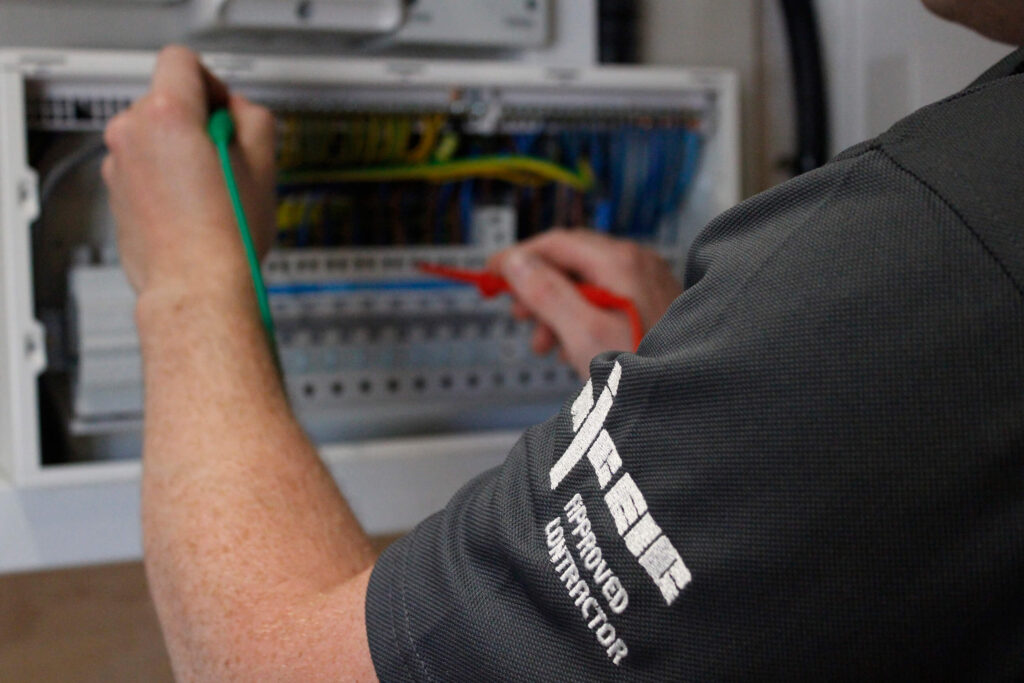 Afterglow Electrical engineer installing renewable energy system in Axminster